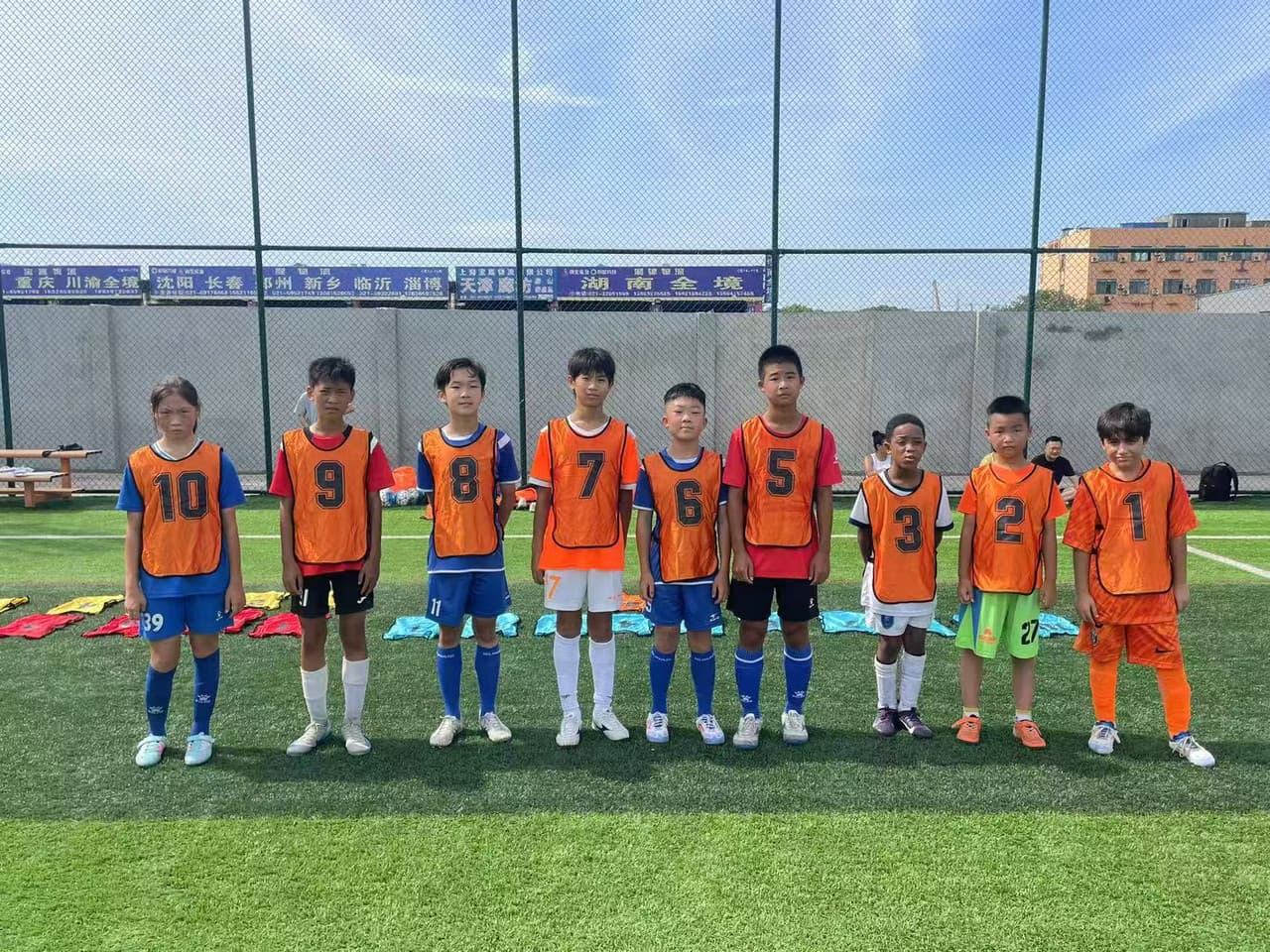 A group of kids in a football training session.